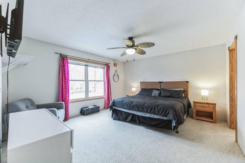 a bedroom with a bed and a ceiling fan at Easton Hills in Spicer