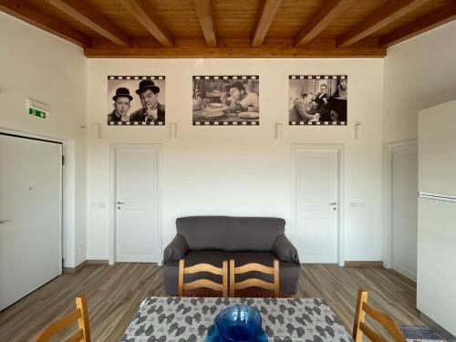 a living room with a table and a couch at Villetta Alcantara Apartment in Calatabiano