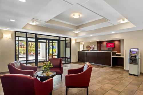 a lobby with chairs and a waiting room at Red Roof Inn PLUS+ Jacksonville – Southpoint in Jacksonville