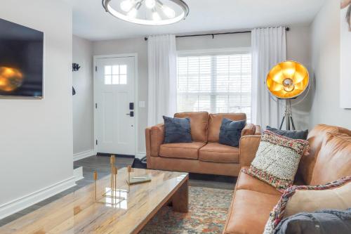 a living room with a couch and a coffee table at Modern Townhome Walk to Tennessee Tech University in Cookeville