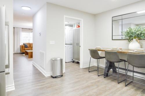 a kitchen and dining room with a table and chairs at Modern Townhome Walk to Tennessee Tech University in Cookeville