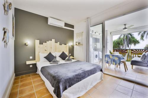 Ένα ή περισσότερα κρεβάτια σε δωμάτιο στο Le Ti' Paradis tropical, Anse Des Rochers vue Mer Studio25m2