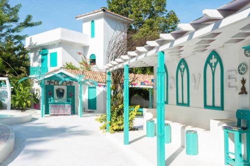 a house with blue and white paint on it at Villa Havana Hues Private Villa in Bentota