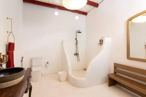 a bathroom with a sink and a mirror at Villa Havana Hues Private Villa in Bentota