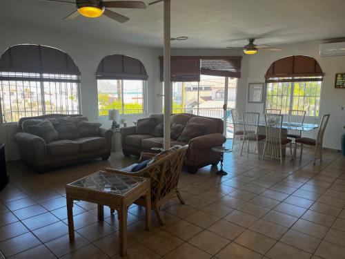 a living room with two couches and a table at Casa Keka Triplex in Playas of San Felipe! in San Felipe
