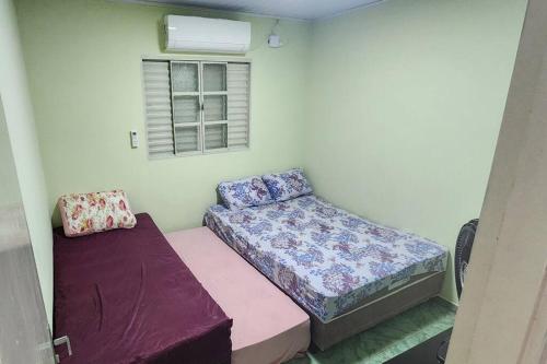 En eller flere senge i et værelse på Casa Completa e Independente