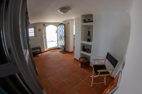 a view of a hallway with a table and a chair at Haus zum Schiff in Ermatingen