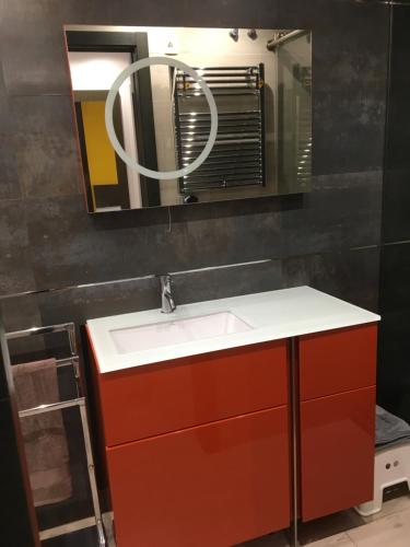 a bathroom with a white sink and a mirror at Atico Pelayo in Castellón de la Plana