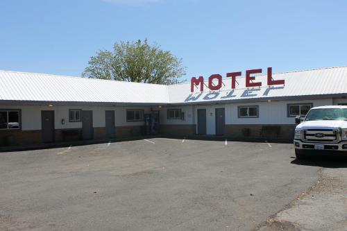a truck parked in a parking lot in front of a motel at Sprague Motel in Sprague