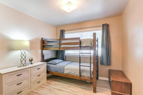 a bedroom with a bunk bed and a desk at 5 Mi to Texas City Dike and Beach Home with Yard! in Texas City
