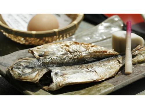 a plate of fish and an egg on a table at Inatori Tokai Hotel Yuen - Vacation STAY 48856v in Inatori