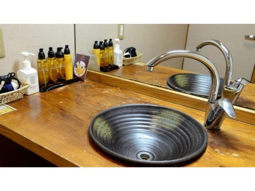 a kitchen counter with a sink and two sinksyss at Inatori Tokai Hotel Yuen - Vacation STAY 48856v in Inatori