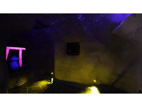 a dark room with pink and purple lights at Inatori Tokai Hotel Yuen - Vacation STAY 61026v in Inatori