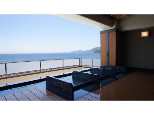 a balcony with a view of the ocean at Inatori Tokai Hotel Yuen - Vacation STAY 48876v in Inatori