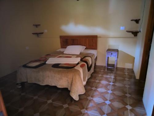 Postel nebo postele na pokoji v ubytování Hotel Coyopolan