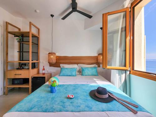Postel nebo postele na pokoji v ubytování Zoe Boutique Hotel