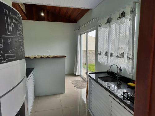 Kuchyň nebo kuchyňský kout v ubytování Casa Azul- Praia Grande- SFS