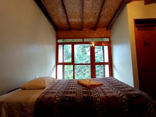 Katil atau katil-katil dalam bilik di INCA COFFEE Lodge Lucmabamba