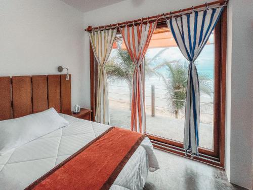 Postel nebo postele na pokoji v ubytování Mi Playa Galapagos Beachfront Apartments