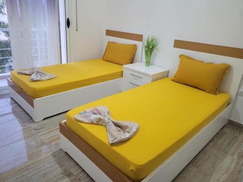 Postel nebo postele na pokoji v ubytování JL tirana resort radhime