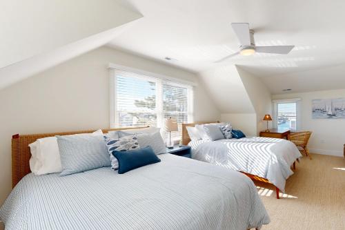 a bedroom with two beds and a ceiling fan at South Bethany --- 106 Brandywine Drive in Bethany Beach
