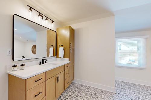 a bathroom with a sink and a mirror at South Bethany --- 106 Brandywine Drive in Bethany Beach
