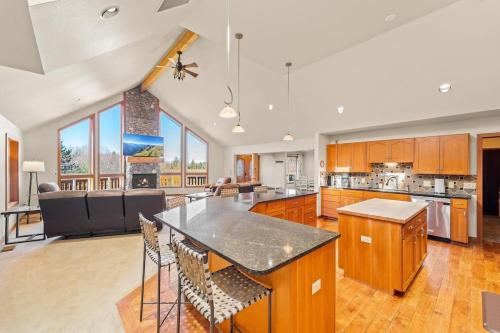a large kitchen with a large island in the middle at Lodge-Style Retreat 10 Acres King Beds in Sedro-Woolley
