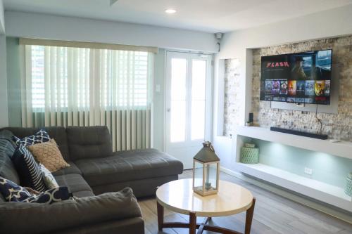 a living room with a couch and a table at Summer Apt Minutes From The Beach in Boqueron
