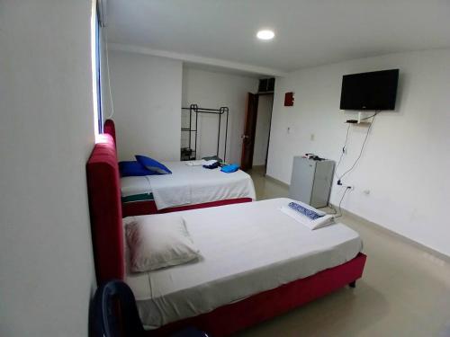 Postel nebo postele na pokoji v ubytování hotel interamericano