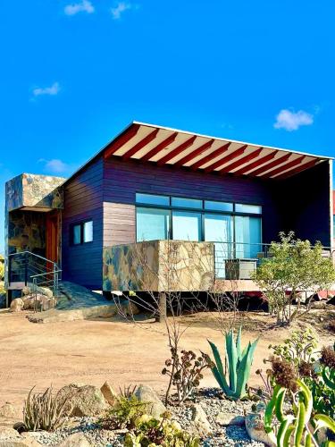 a house in the middle of a desert at Siempre Valle Hotel Boutique in Valle de Guadalupe