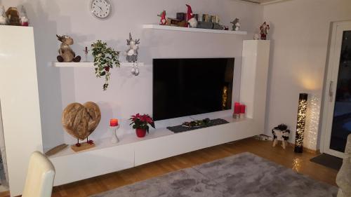 a living room with a flat screen tv at Ferienwohnung Weserperle in Nordenham