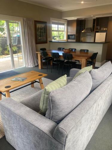 a living room with a couch and a table at The White Swan Hotel in Greytown
