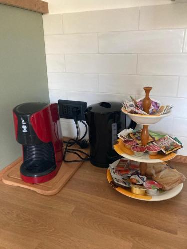 a plate of food on a counter next to a coffee maker at Casa Matilde in Sanremo