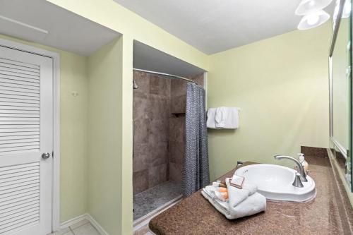 a bathroom with a sink and a shower at 118 E Whiting St B Side in South Padre Island