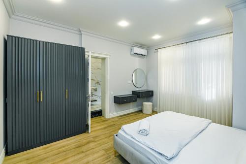 Ένα ή περισσότερα κρεβάτια σε δωμάτιο στο New Deluxe Apartment