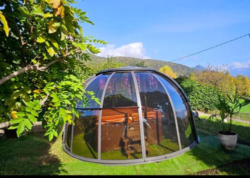 a dome house is sitting in the grass at B&B Margot in Albavilla