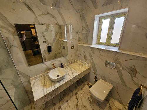 a bathroom with a sink and a toilet at Happy Villa For Families Only in Alexandria