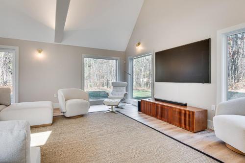 a living room with a large flat screen tv at Custom-Built Home Near Piscataqua River! in Eliot