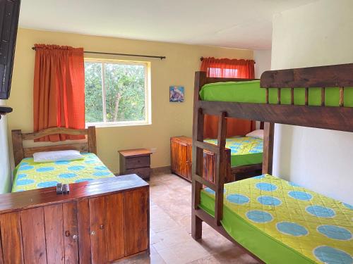 Postel nebo postele na pokoji v ubytování Finca Hotel La Ponderosa