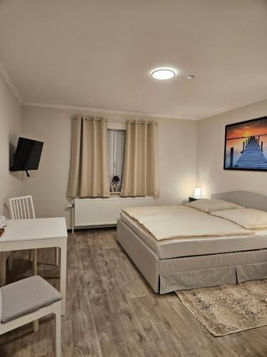 En eller flere senge i et værelse på Medelby Inn