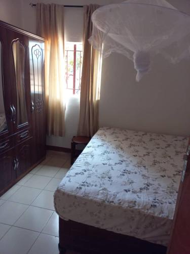 Ένα ή περισσότερα κρεβάτια σε δωμάτιο στο Kaz Villa