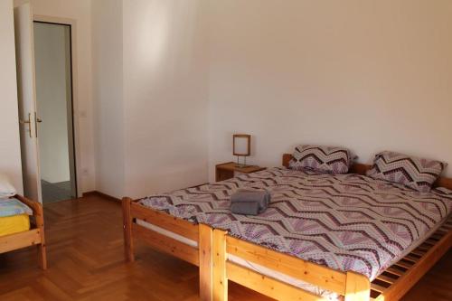 Ένα ή περισσότερα κρεβάτια σε δωμάτιο στο La Perla di Bre'