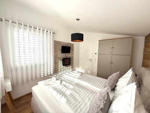 Postel nebo postele na pokoji v ubytování Ena Appartements