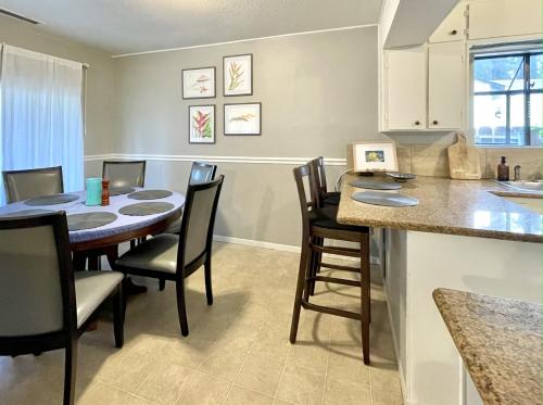 a kitchen and dining room with a table and chairs at Homestead Haven in Concord