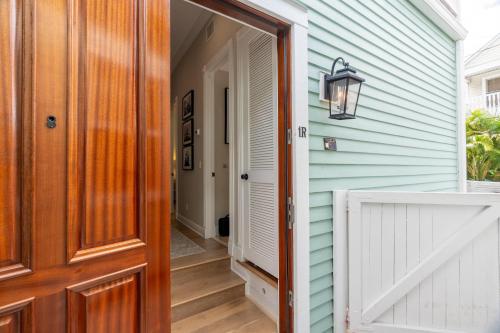 an open door to a house with a porch at American Shoal Light Suite in Key West