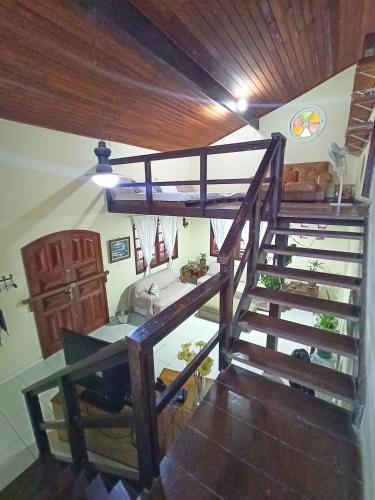 a room with a wooden staircase with a sink at Casa do Bosque, 367 in Rio das Ostras