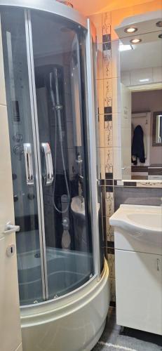 a bathroom with a shower and a sink at Centar ljubavi in Kruševac