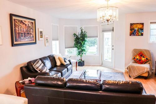a living room with a couch and a table at Condo de charme familial in Brossard