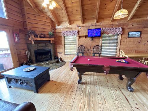 a living room with a pool table in a cabin at Honeymoon View #1 in Little Cove