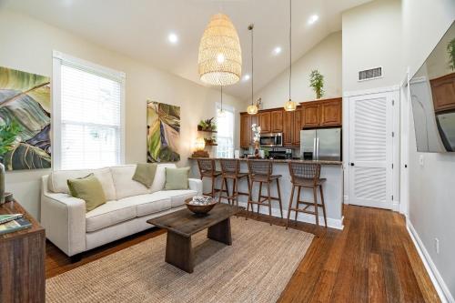 a living room with a couch and a table at Tortugas Harbor Light Suite in Key West